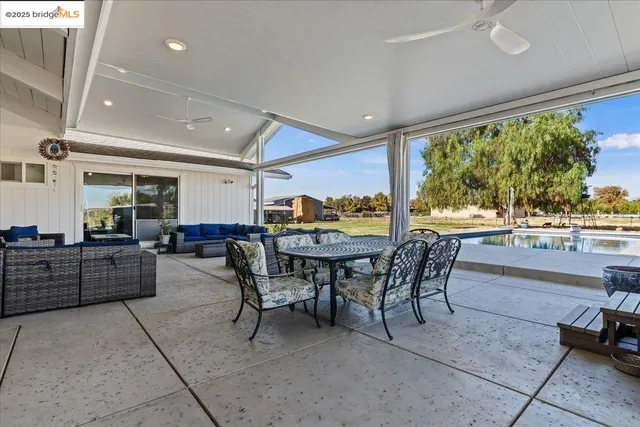 a view of a dining room with furniture window and outside view