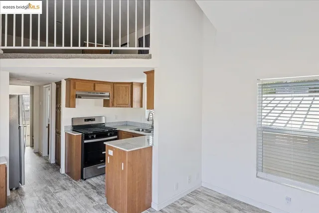 a kitchen with stainless steel appliances a stove and a refrigerator