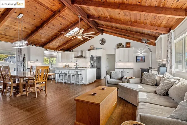 a living room with lots of furniture and white walls