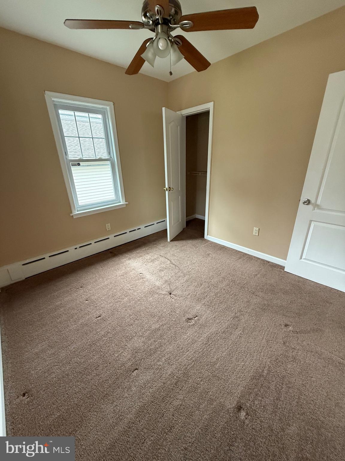 232 South Highland Road Springfield, PA 19064 - Photo 17 of 58 an empty room with windows and fan