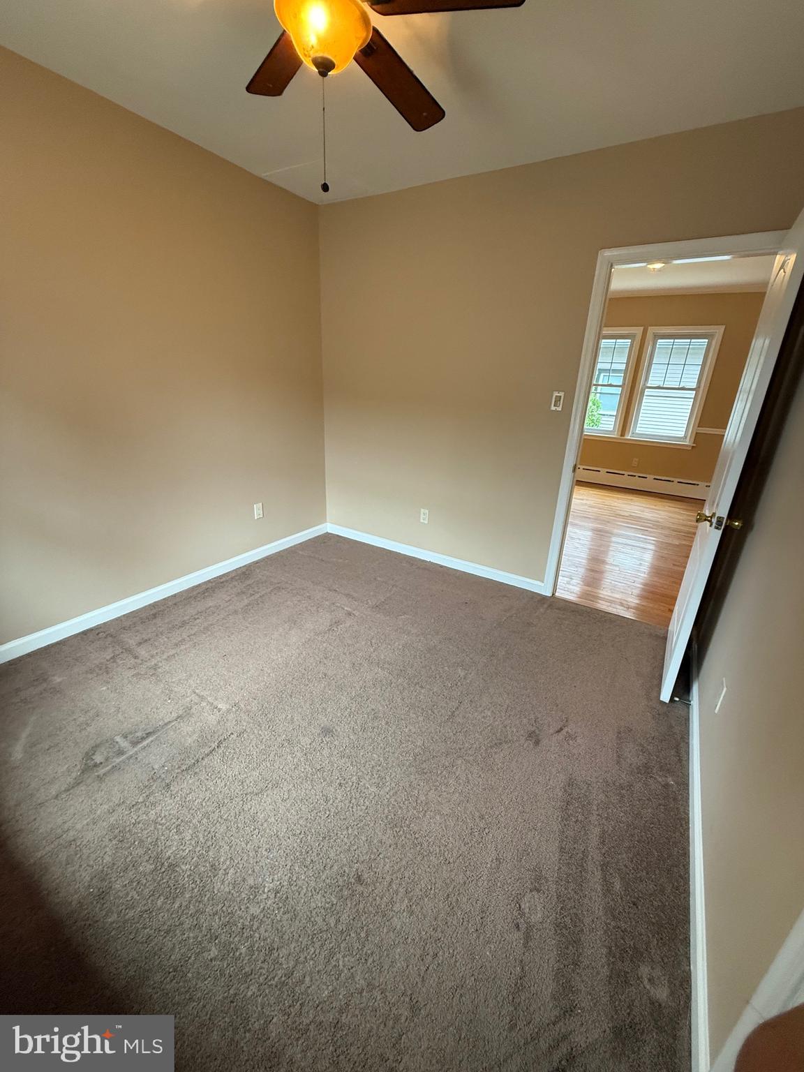 232 South Highland Road Springfield, PA 19064 - Photo 19 of 58 an empty room with a ceiling fan and a window