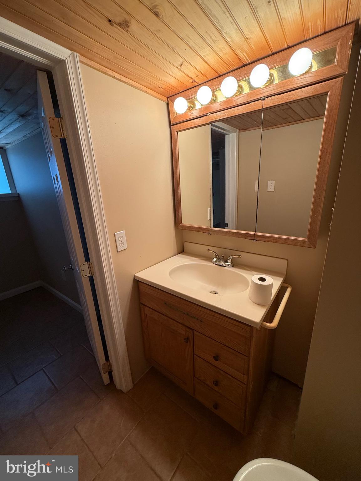 232 South Highland Road Springfield, PA 19064 - Photo 37 of 58 half bathroom in basement next to laundry room