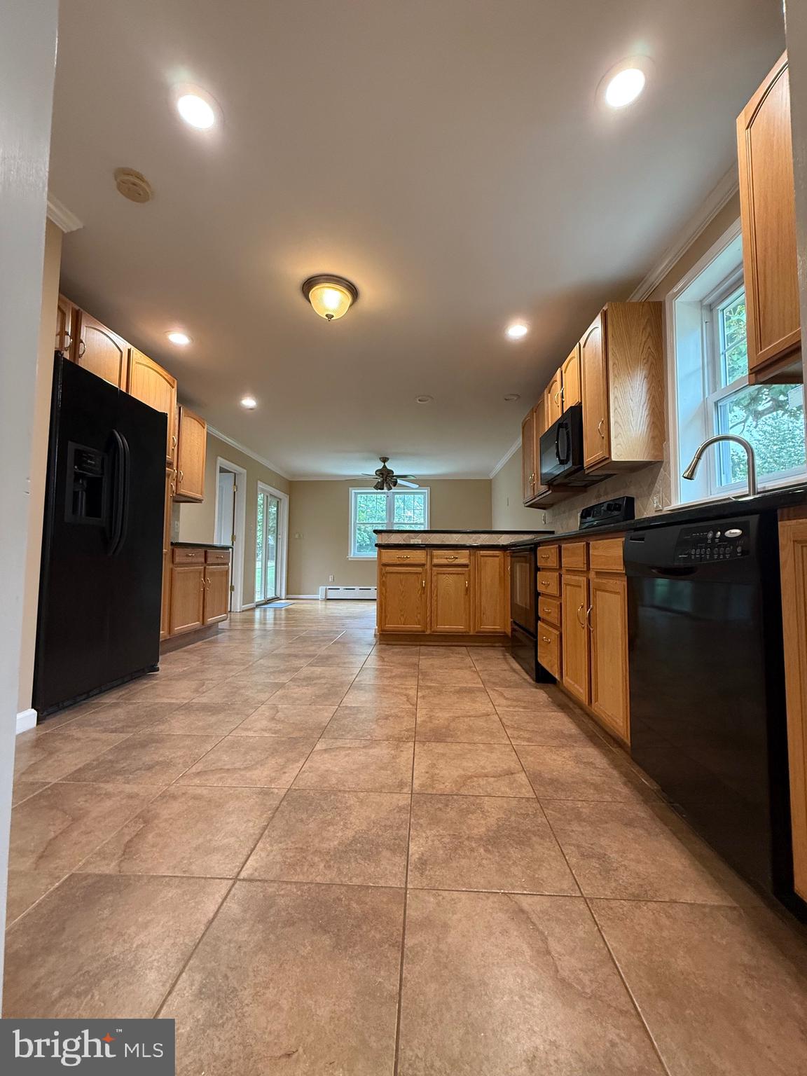 232 South Highland Road Springfield, PA 19064 - Photo 4 of 58 a kitchen with stainless steel appliances granite countertop a refrigerator and a stove top oven