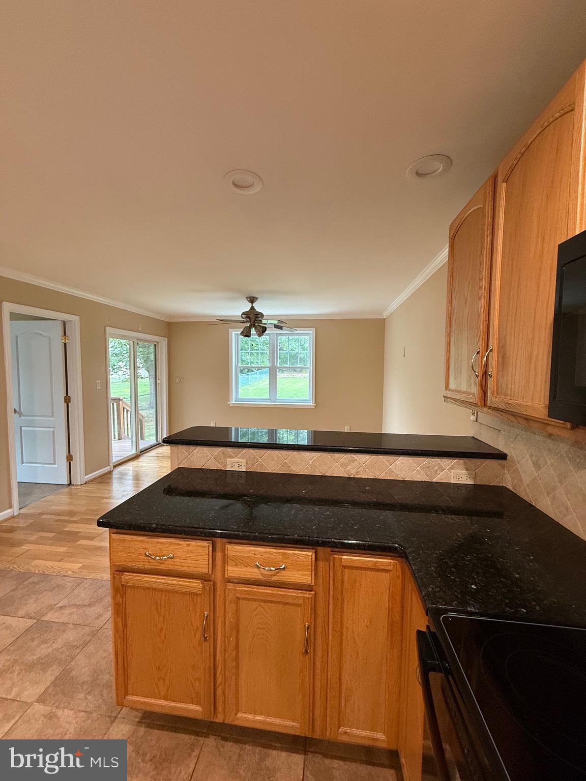 232 South Highland Road Springfield, PA 19064 - Photo 47 of 58 a kitchen with granite countertop a sink and a stove top oven