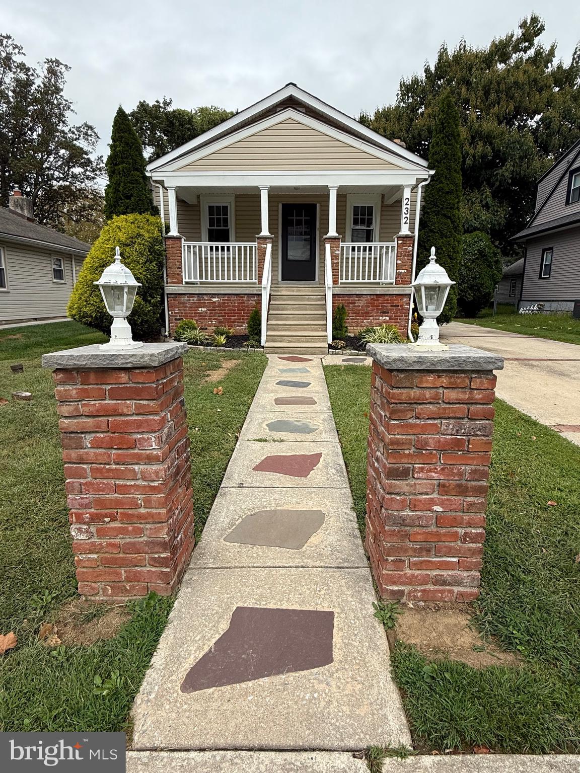232 South Highland Road Springfield, PA 19064 - Photo 6 of 58 a front view of a house with garden