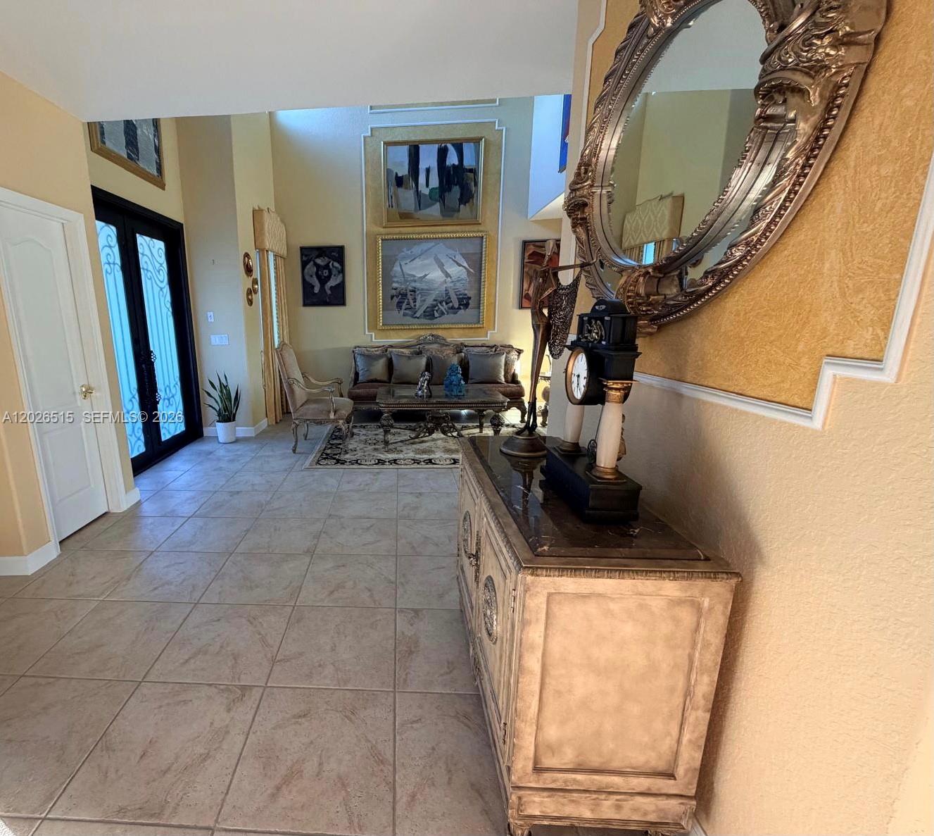 1065 Southwest 150th Place Miami, FL 33194 - Photo 7 of 14 a workspace with furniture and a mirror