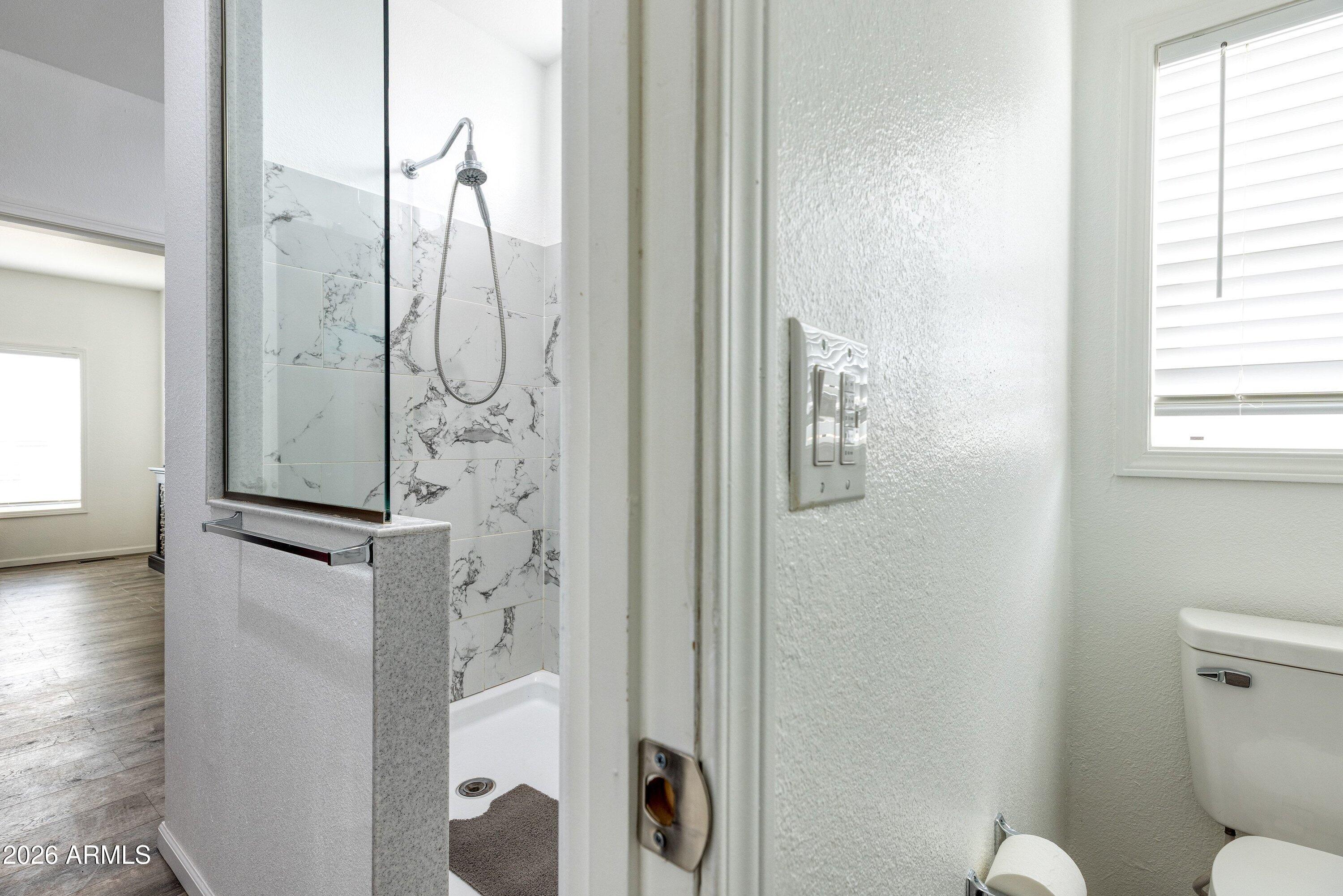 6644 Avanti Way Show Low, AZ 85901 - Photo 13 of 29 a bathroom with a shower and a toilet
