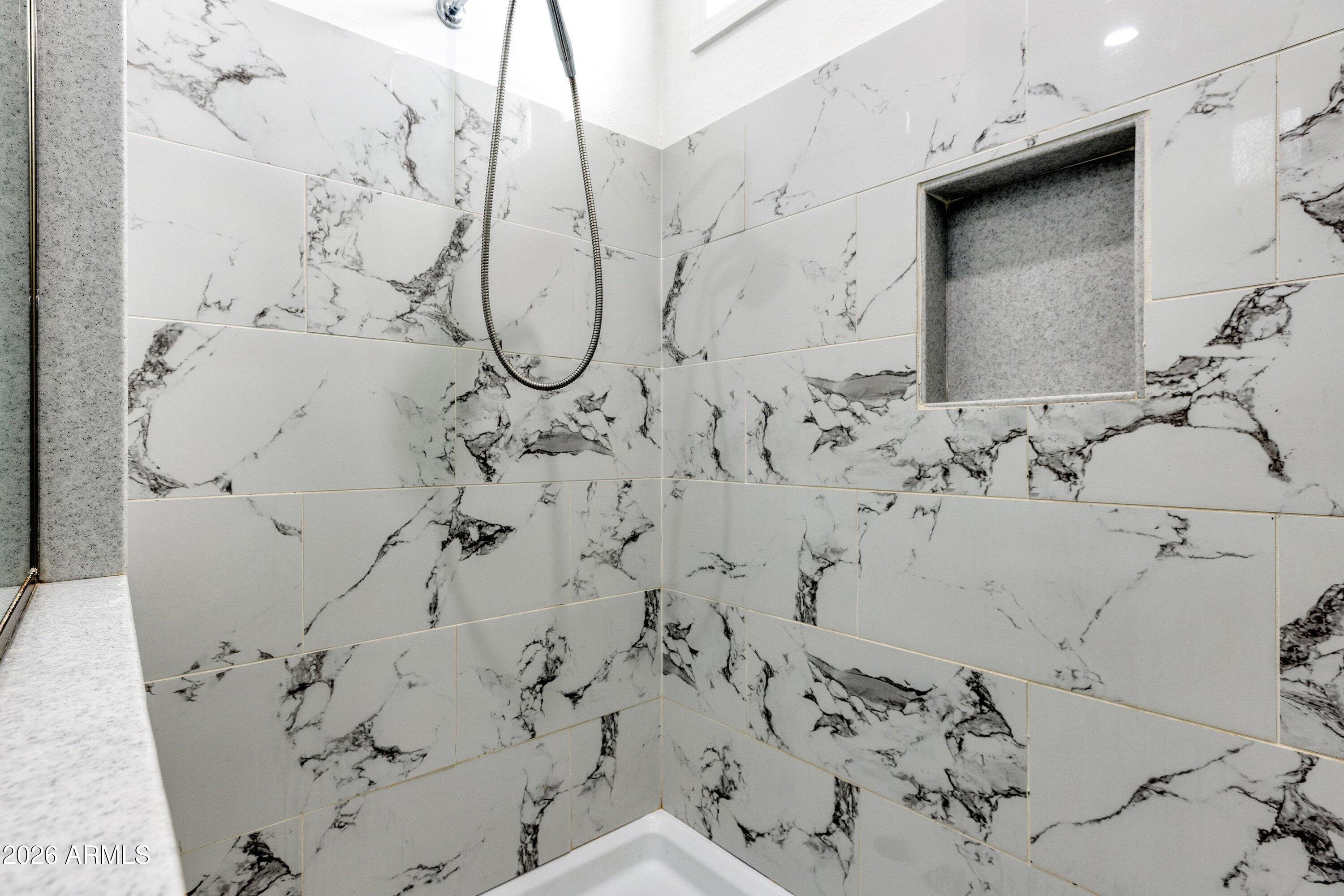 6644 Avanti Way Show Low, AZ 85901 - Photo 14 of 29 a bathroom with a bathtub and shower