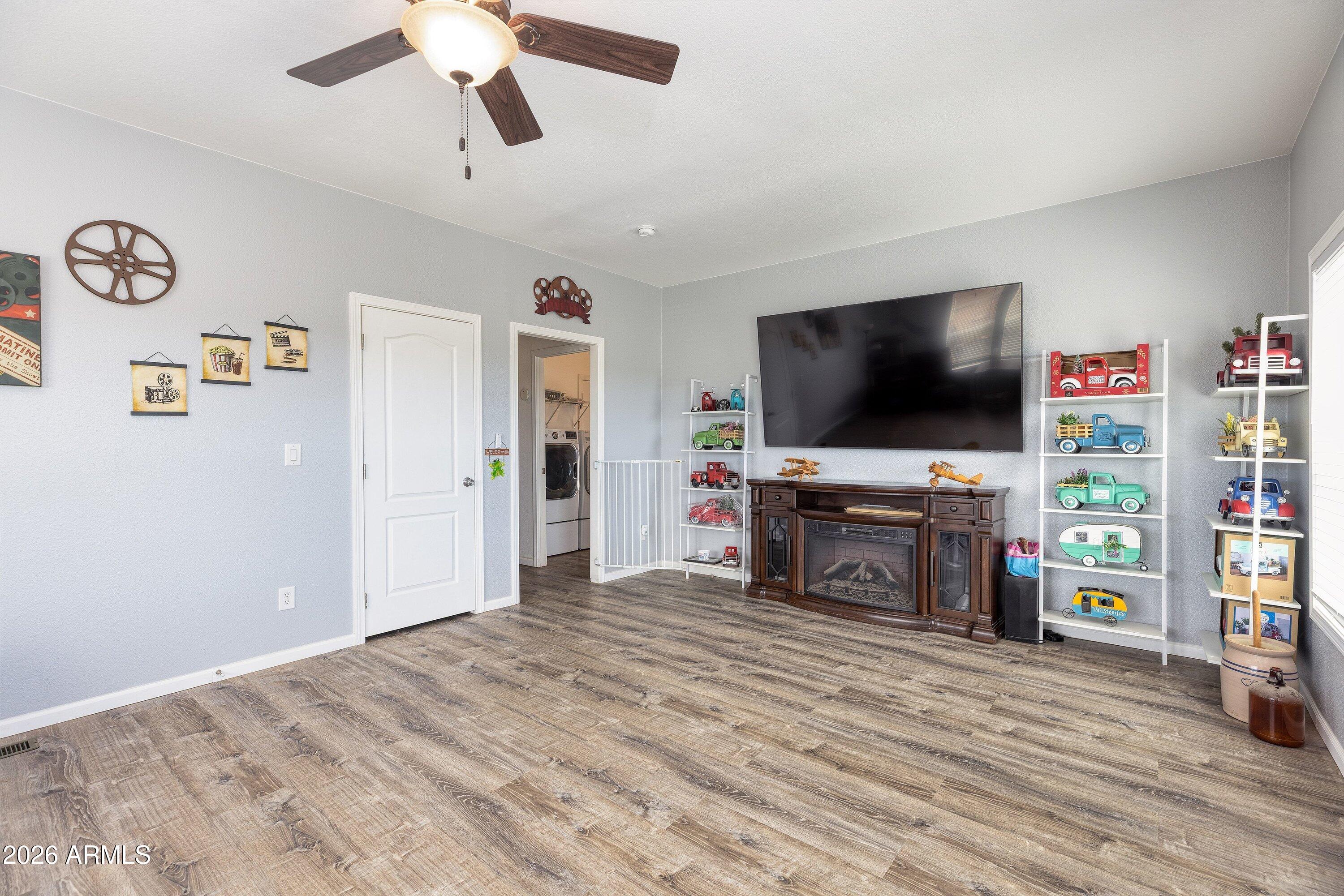 6644 Avanti Way Show Low, AZ 85901 - Photo 17 of 29 a view of a livingroom with furniture and a flat screen tv
