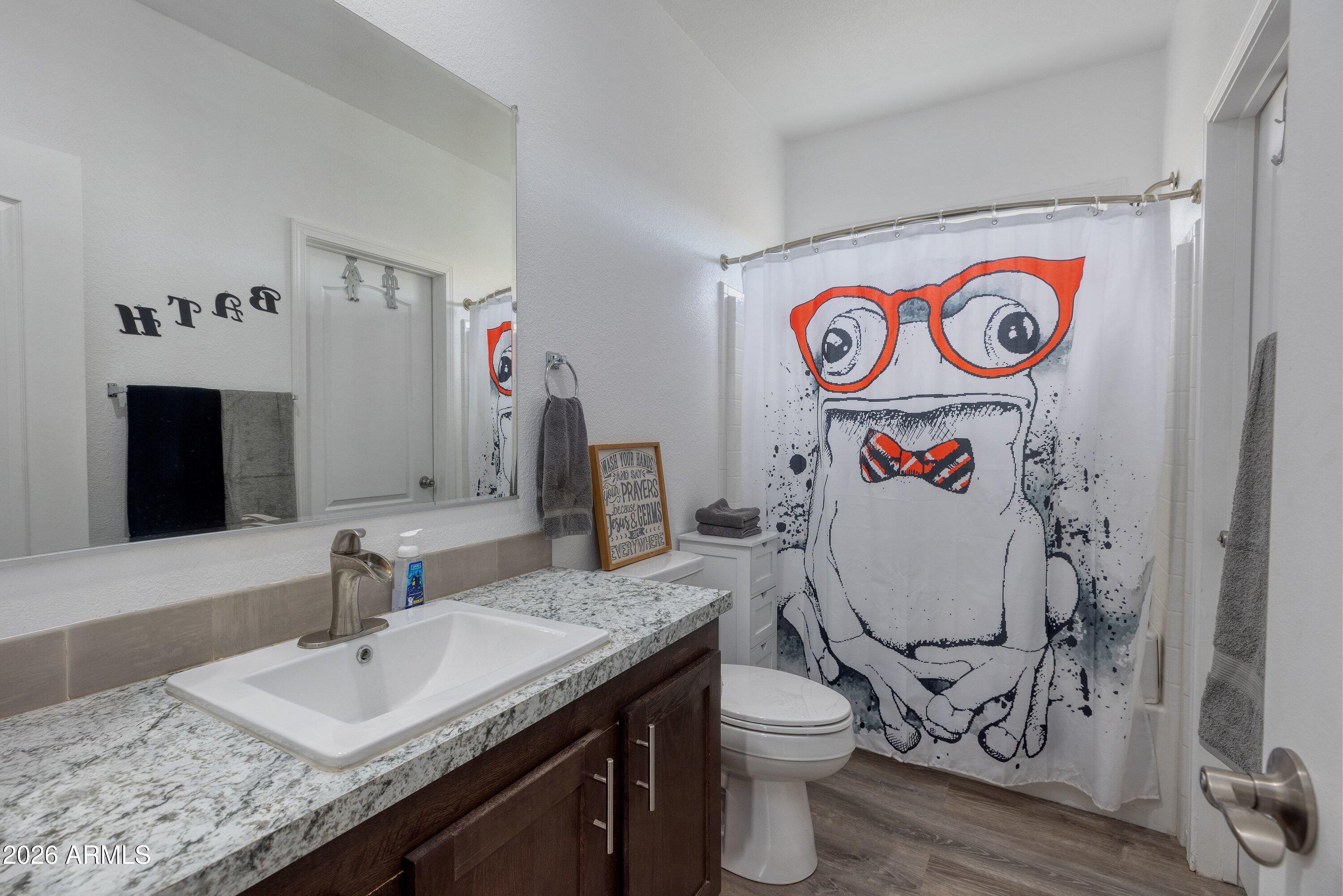 6644 Avanti Way Show Low, AZ 85901 - Photo 19 of 29 a bathroom with a sink and a mirror