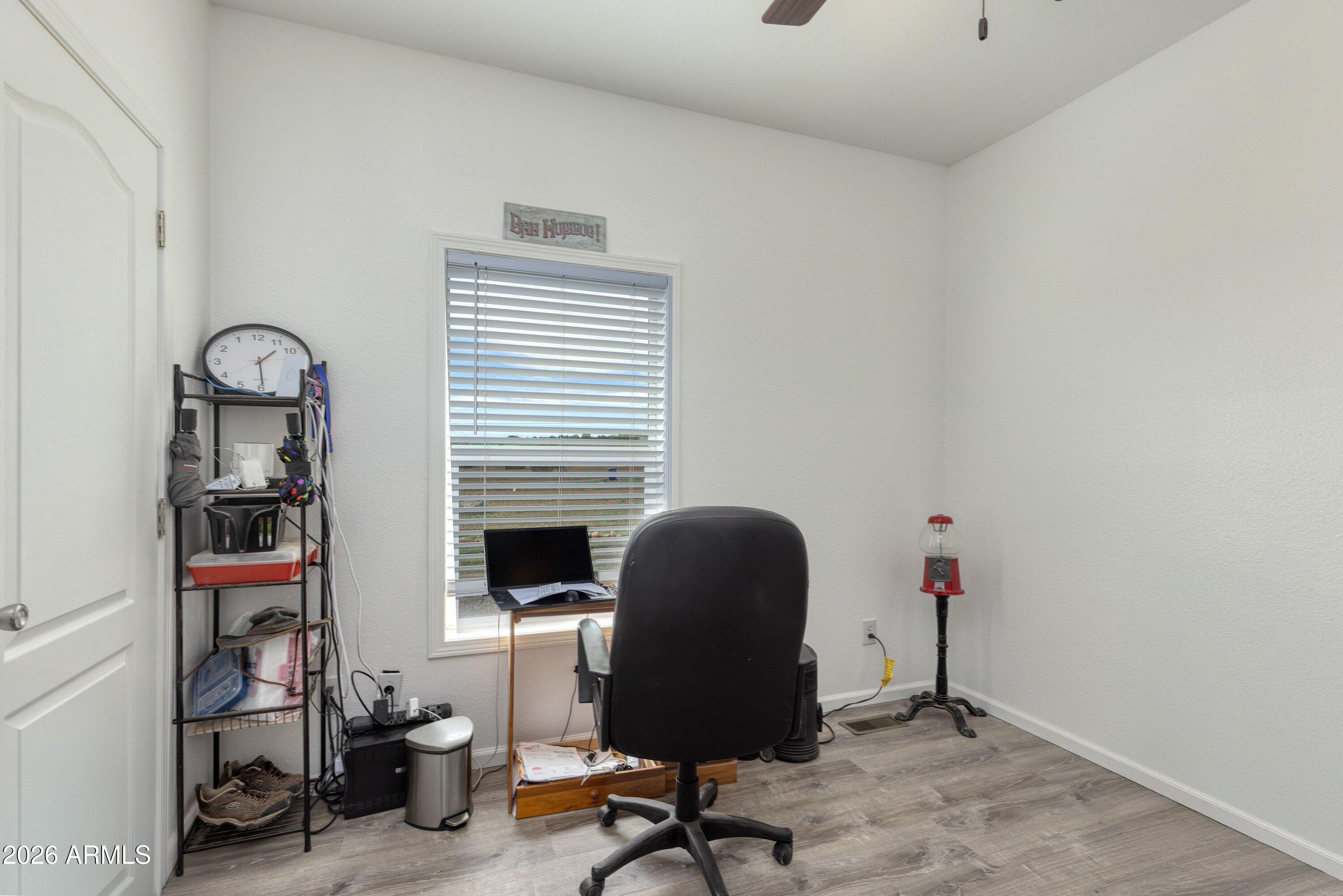 6644 Avanti Way Show Low, AZ 85901 - Photo 21 of 29 a view of a workspace with furniture and a window