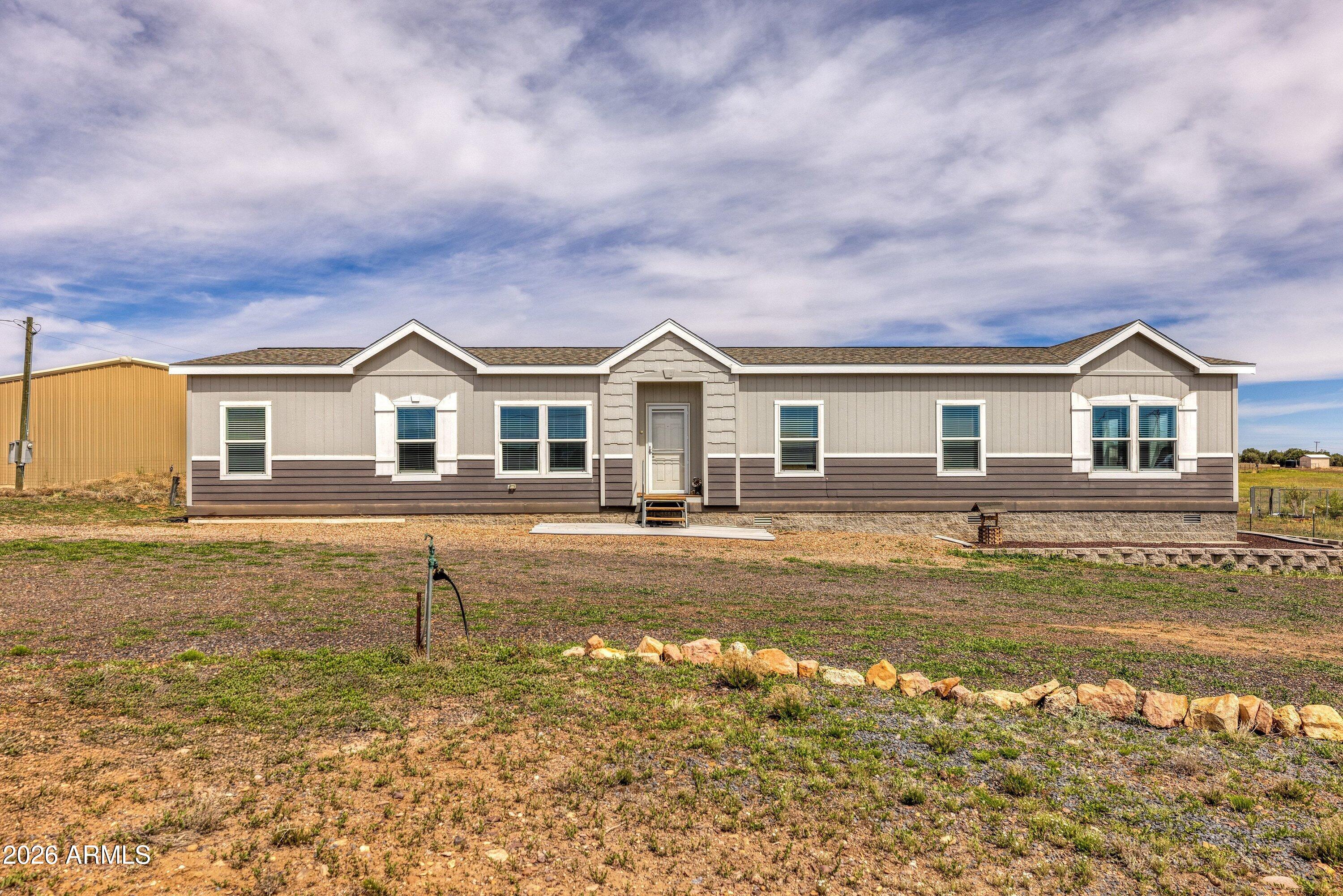6644 Avanti Way Show Low, AZ 85901 - Photo 5 of 29 a view of house with swimming pool and yard