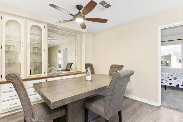 a dining room with furniture and window