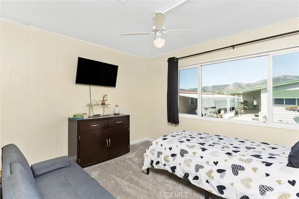 a bedroom with a bed and television