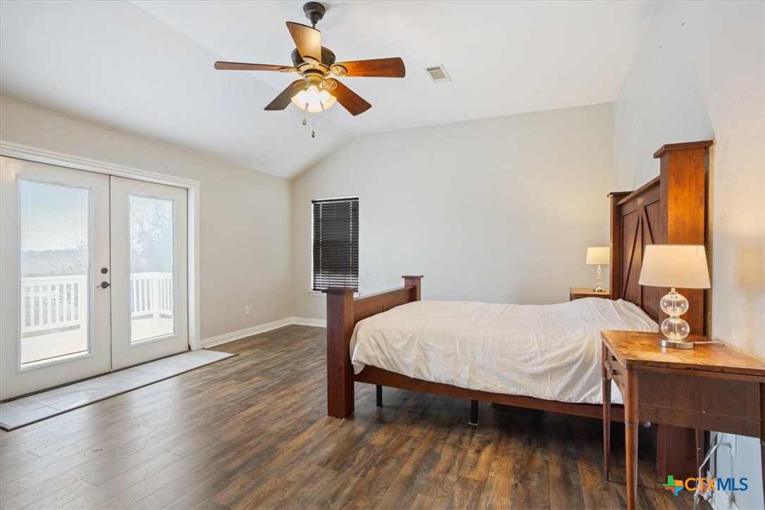 8600 Five Wells Road Rogers, TX 76569 - Photo 18 of 47 a bedroom with a bed and a table in it