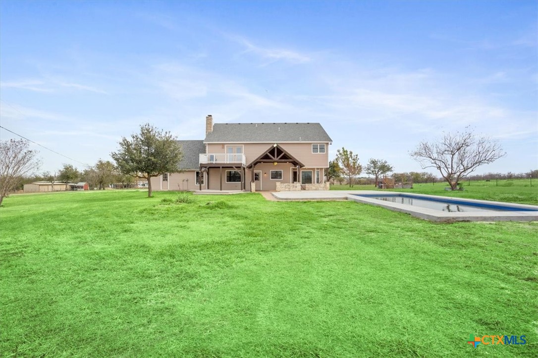 8600 Five Wells Road Rogers, TX 76569 - Photo 27 of 47 a view of a house with a big yard