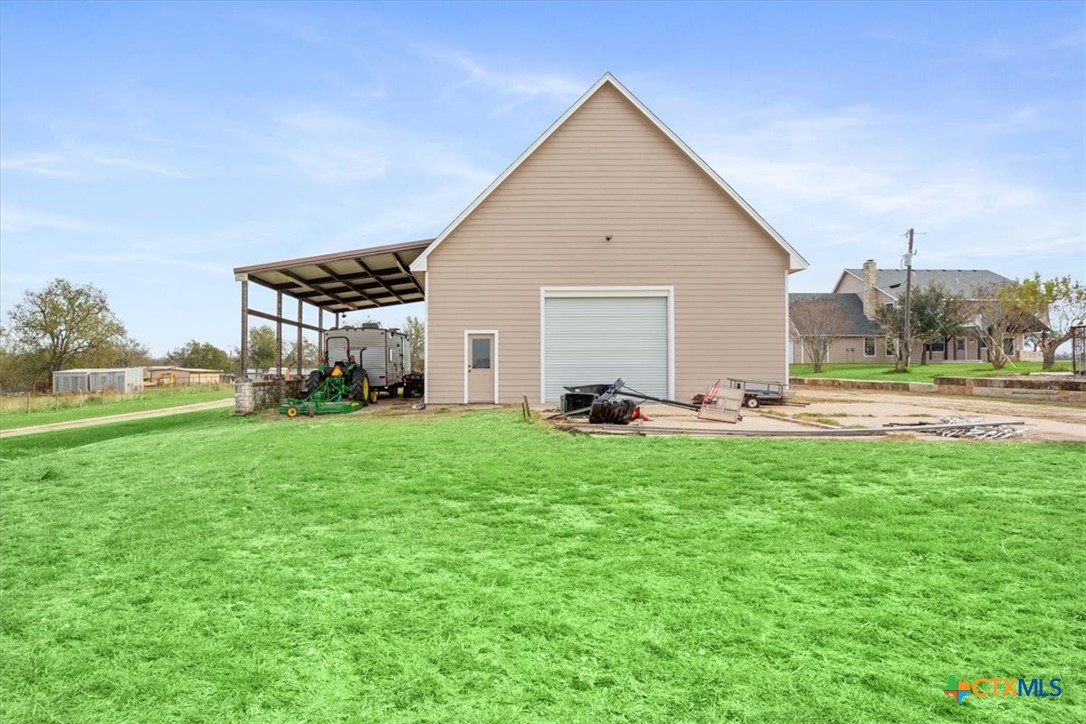 8600 Five Wells Road Rogers, TX 76569 - Photo 28 of 47 a view of a house with backyard