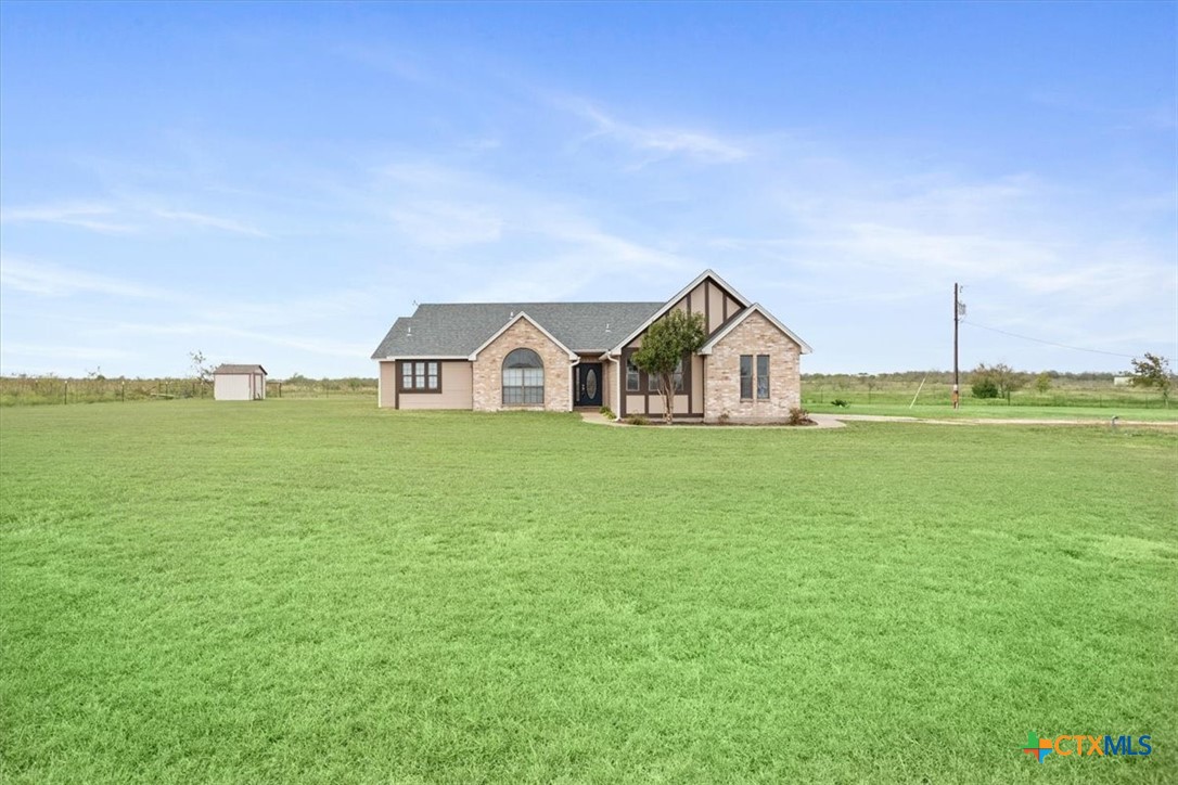 8600 Five Wells Road Rogers, TX 76569 - Photo 30 of 47 a view of a house with a yard and deck