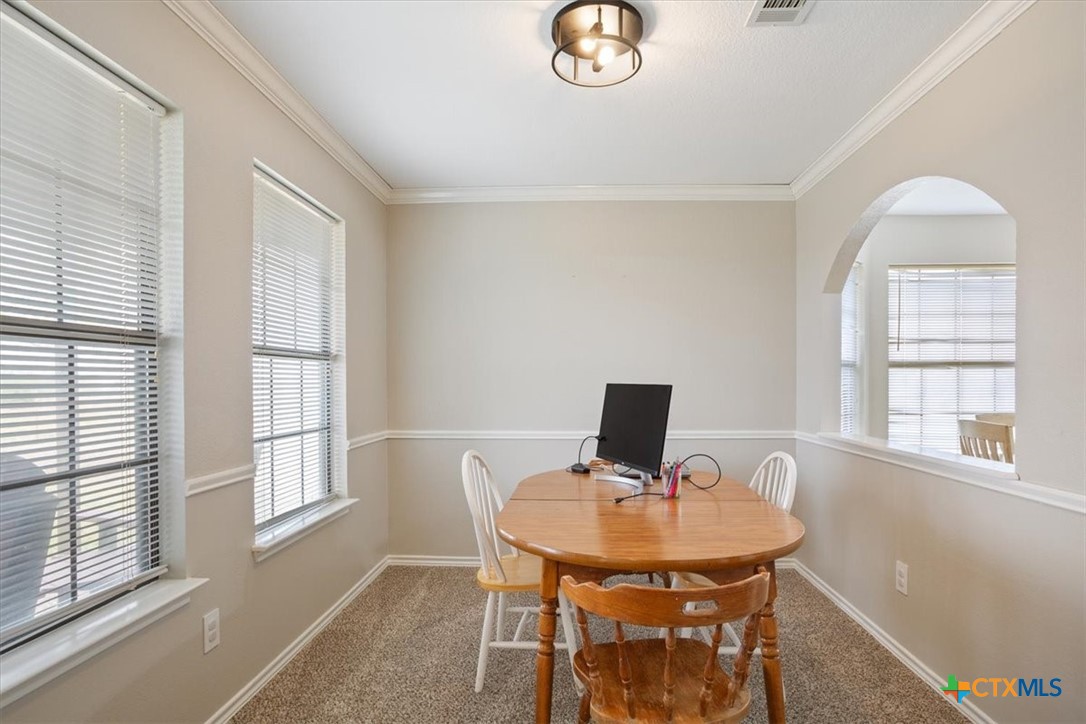 8600 Five Wells Road Rogers, TX 76569 - Photo 35 of 47 a view of a workspace with furniture and a window