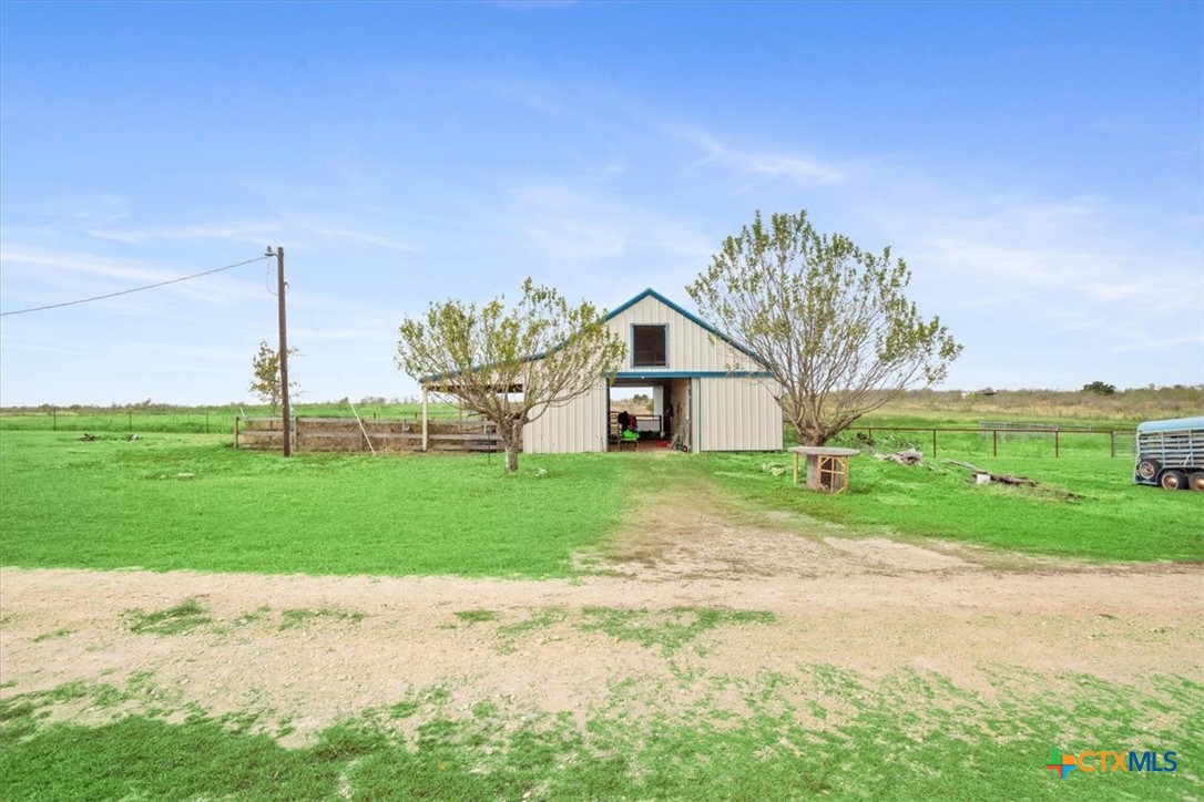 8600 Five Wells Road Rogers, TX 76569 - Photo 45 of 47 a view of a house next to a yard with big trees