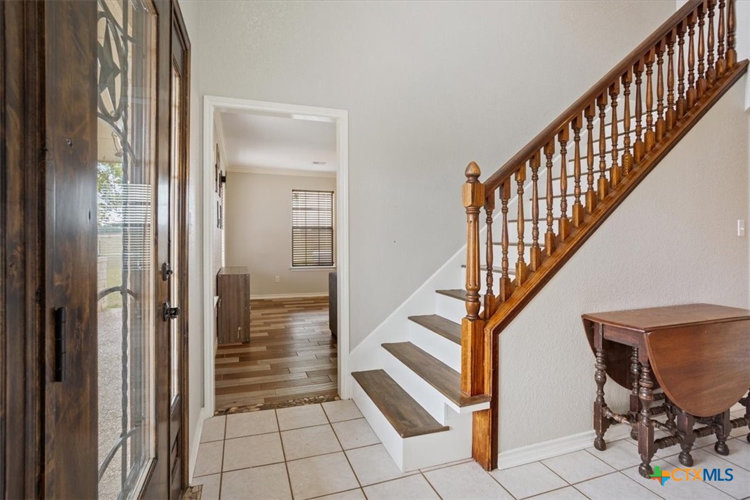 8600 Five Wells Road Rogers, TX 76569 - Photo 6 of 47 a view of entryway and hall with wooden floor