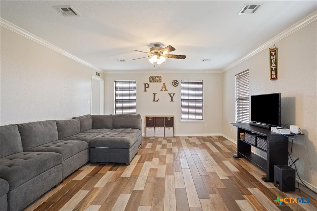 8600 Five Wells Road Rogers, TX 76569 - Photo 10 of 47 a living room with furniture and a flat screen tv