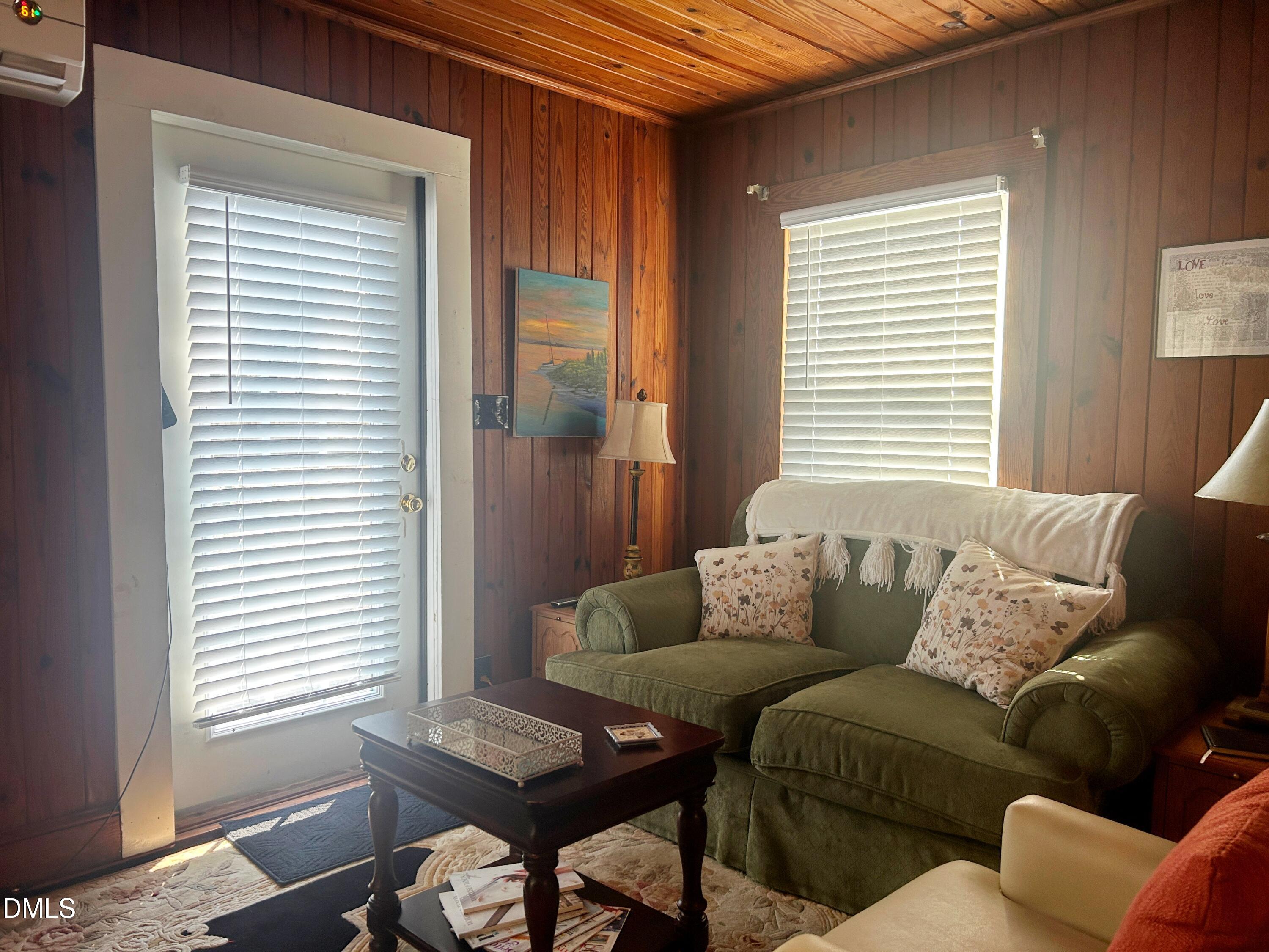 405 Sunset Avenue Clinton, NC 28328 - Photo 31 of 47 a living room with furniture and a window
