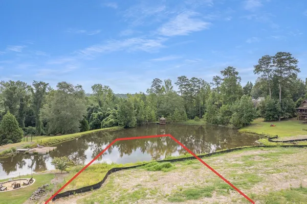 a view of swimming pool with a yard
