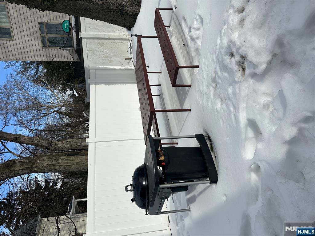 122 Dean Drive, Unit 1 Tenafly, NJ 07670 - Photo 14 of 15 a view of a bench in wooden deck