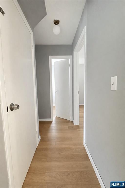 122 Dean Drive, Unit 1 Tenafly, NJ 07670 - Photo 6 of 15 a view of a hallway with wooden floor