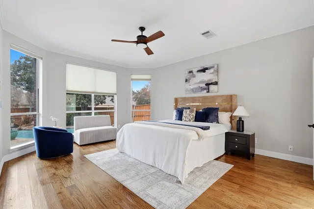 a bedroom with a large bed and a couch