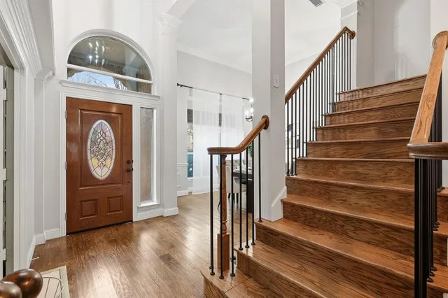 a view of entryway with wooden floor