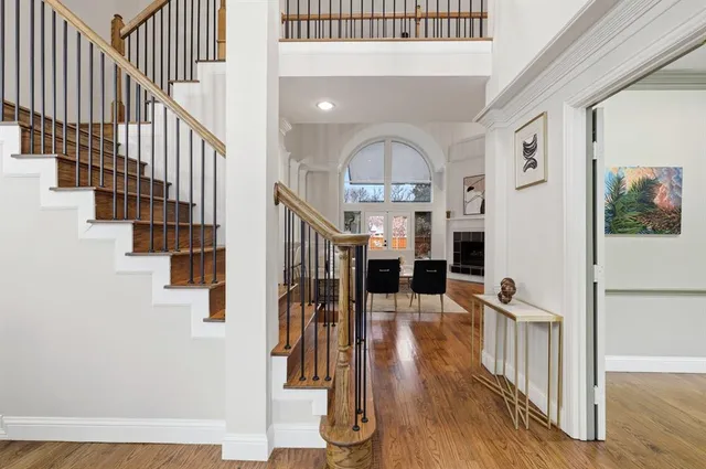 a view of entryway and hall with wooden floor