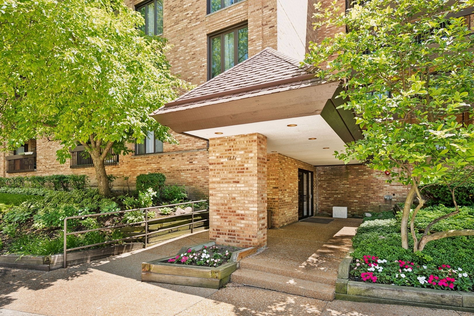 a view of a patio with table and chairs and potted plants