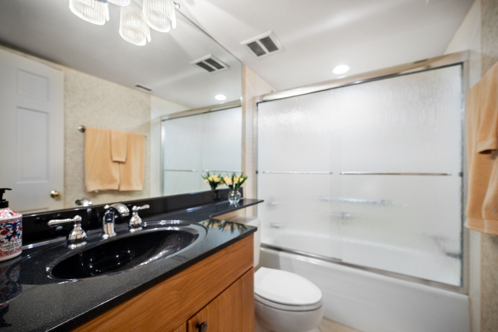 1671 Mission Hills Road, Unit 501 Northbrook, IL 60062 - Photo 16 of 27 a bathroom with a granite countertop sink a toilet and shower