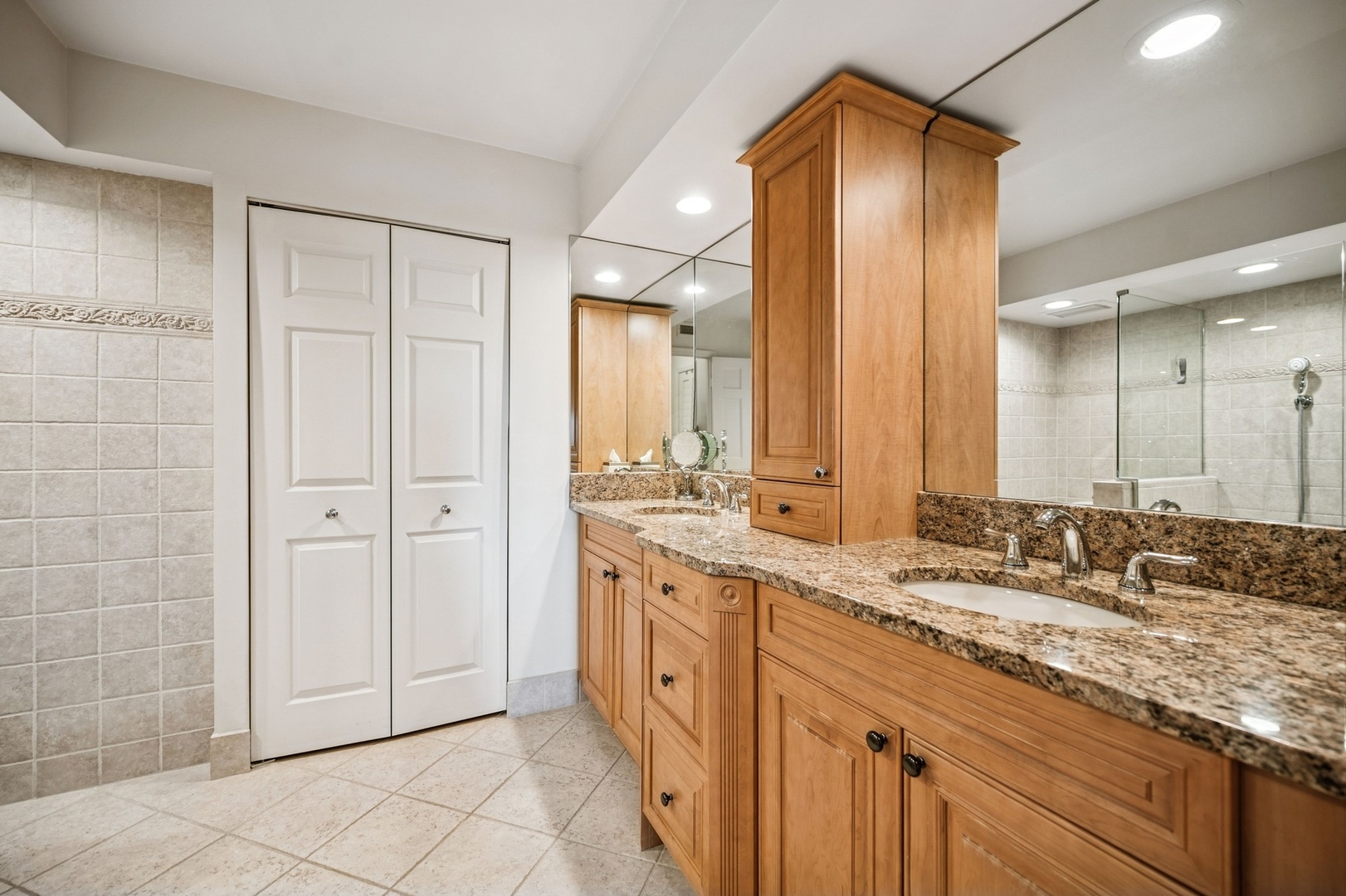 1671 Mission Hills Road, Unit 501 Northbrook, IL 60062 - Photo 19 of 27 a bathroom with a granite countertop sink mirror and double