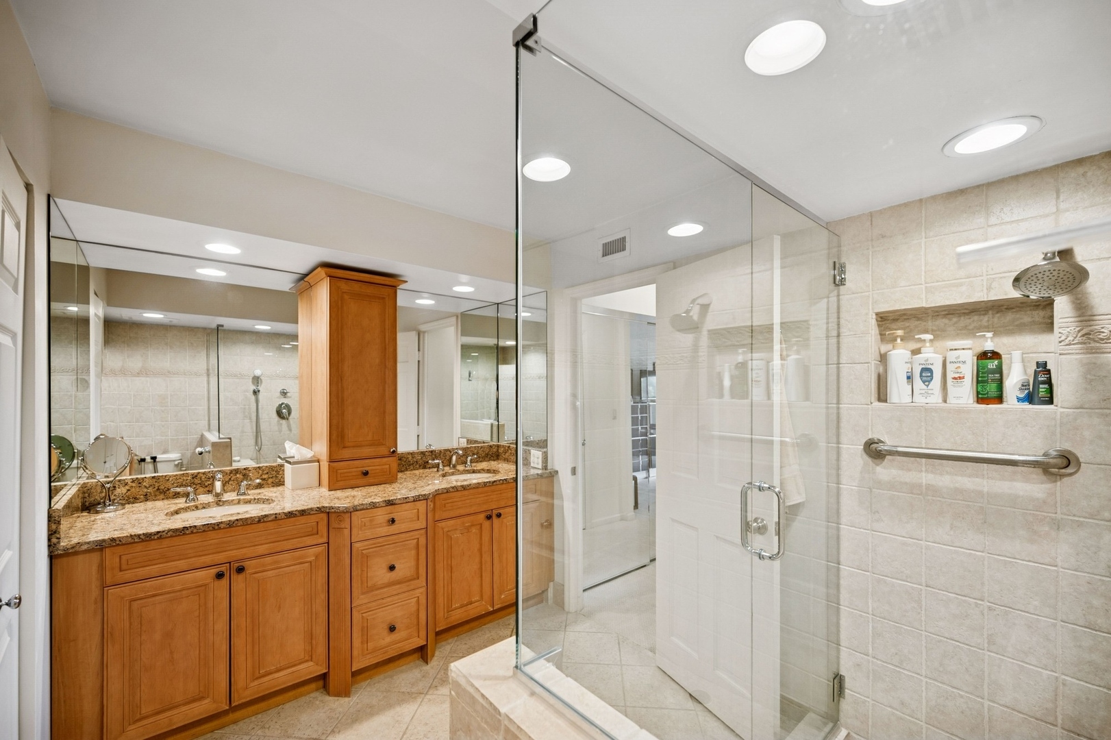 1671 Mission Hills Road, Unit 501 Northbrook, IL 60062 - Photo 20 of 27 a spacious bathroom with a shower sink double and mirror