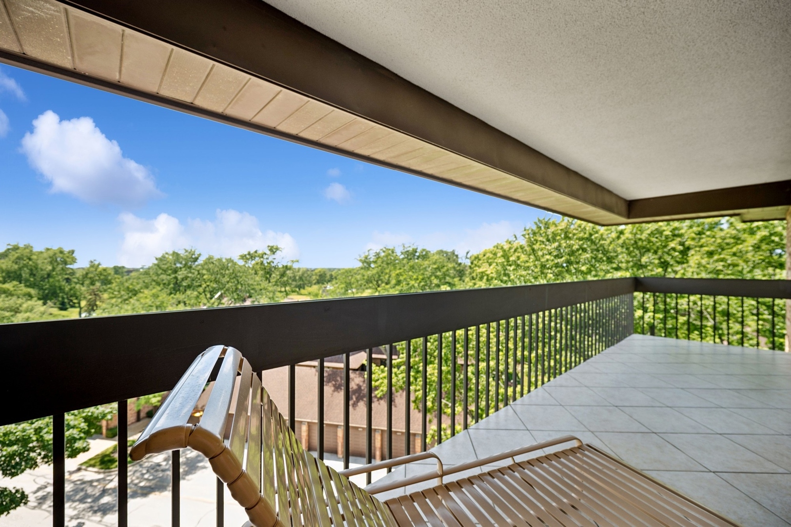 1671 Mission Hills Road, Unit 501 Northbrook, IL 60062 - Photo 25 of 27 a view of balcony with wooden floor and outdoor seating