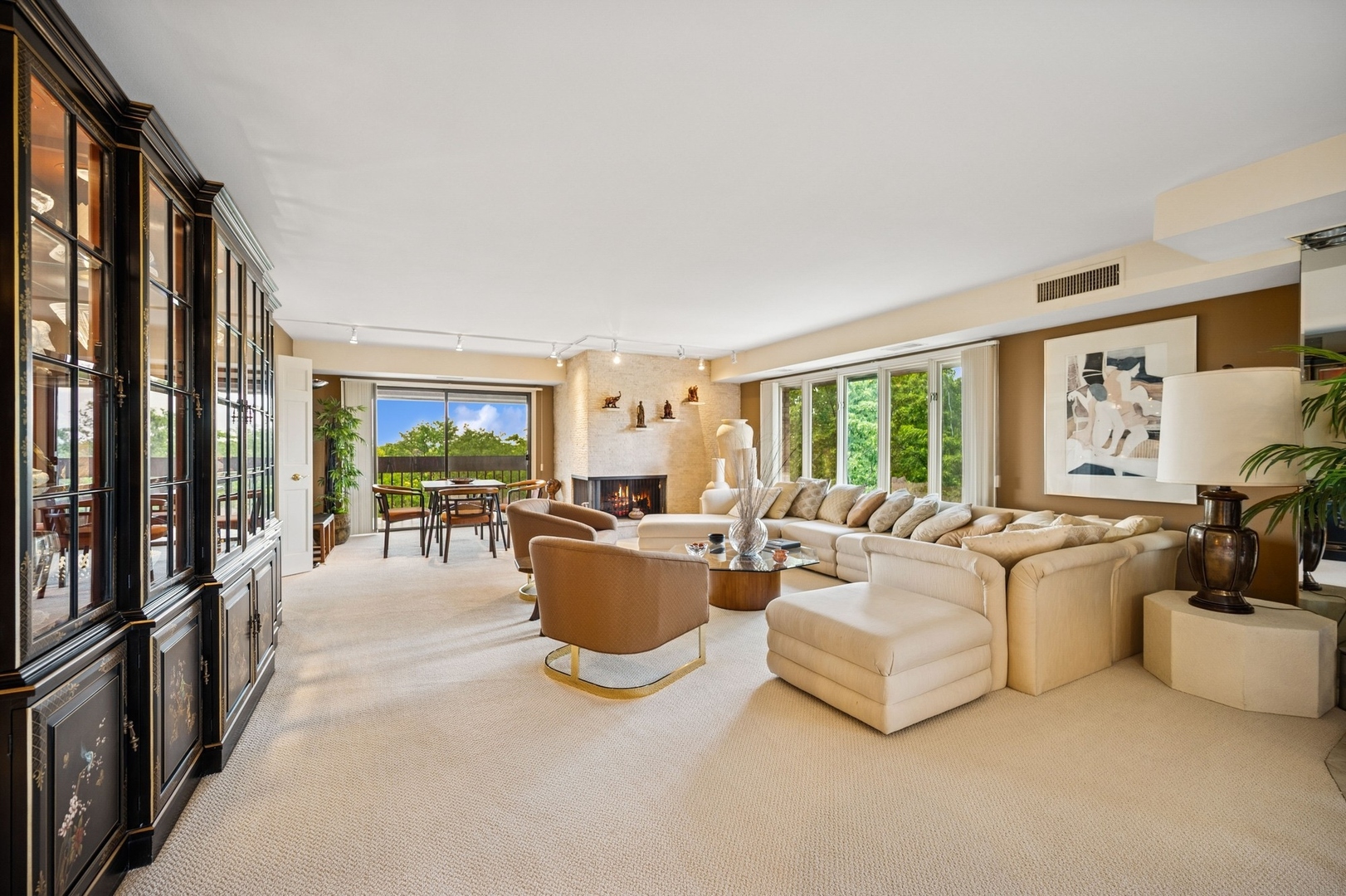 1671 Mission Hills Road, Unit 501 Northbrook, IL 60062 - Photo 3 of 27 a living room with furniture a large window and flat screen tv