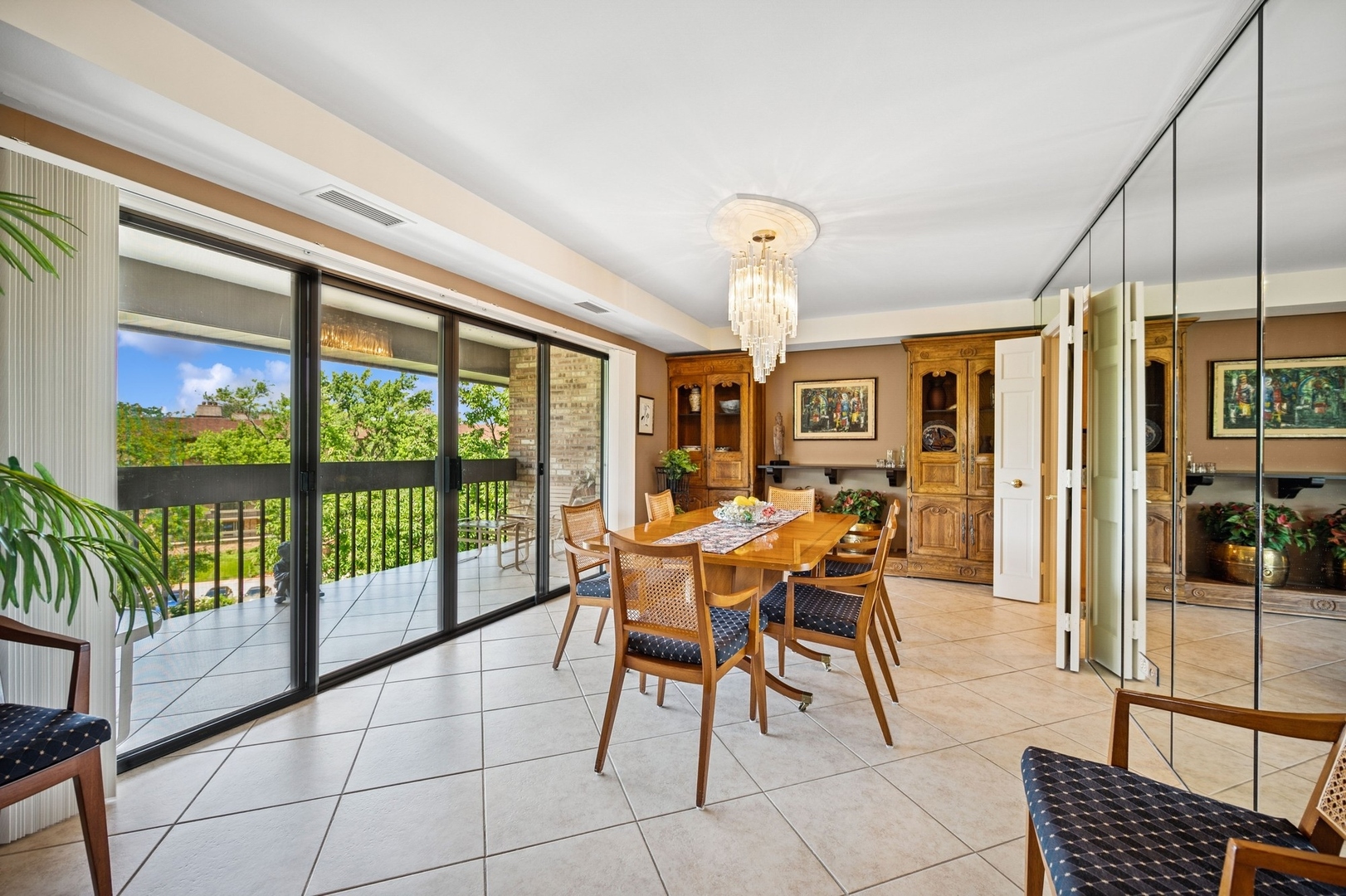 1671 Mission Hills Road, Unit 501 Northbrook, IL 60062 - Photo 8 of 27 a view of a dining room with furniture wooden floor and chandelier