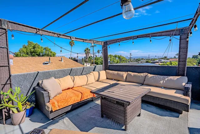 a outdoor living space with furniture and a potted plant