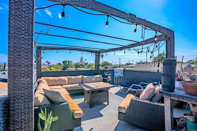 a outdoor space with patio furniture and potted plants