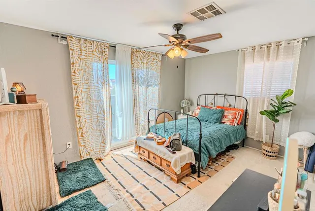 a bathroom with a sink toilet and shower curtain
