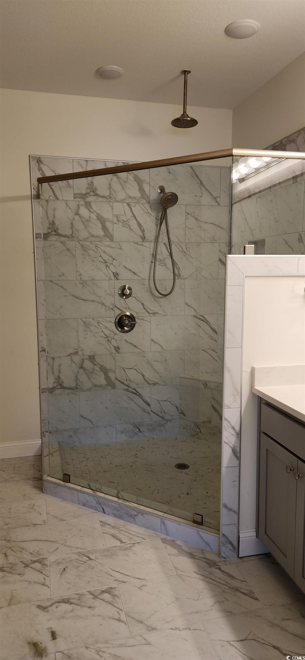 1147 Freeboard Street, Unit 201 Murrells Inlet, SC 29576 - Photo 31 of 38 Bathroom featuring tiled shower and vanity