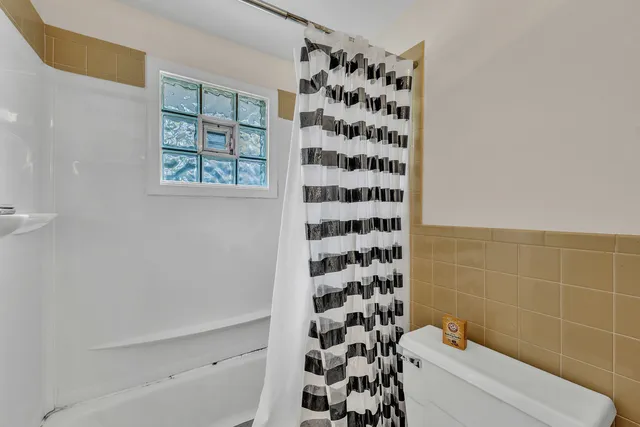 a bathroom with a bathtub and shower
