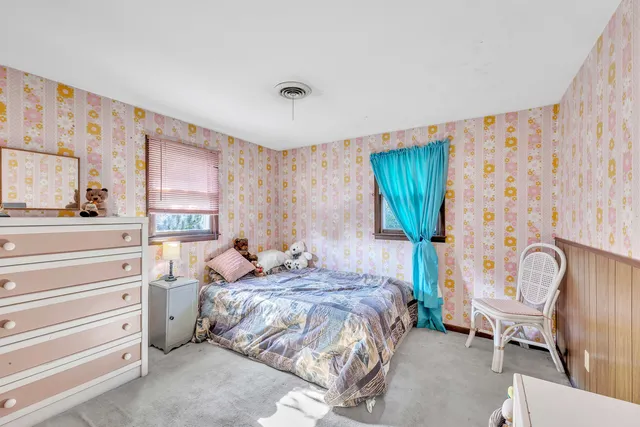 a bedroom with a bed and furniture