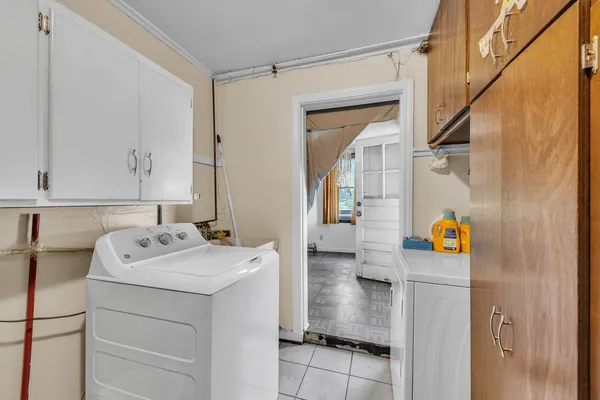 a utility room with dryer and washer