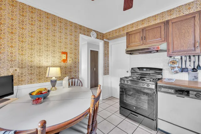 a kitchen with a stove and a sink