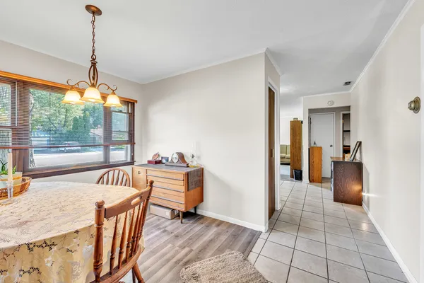 a view of a dining room with furniture window and outside view