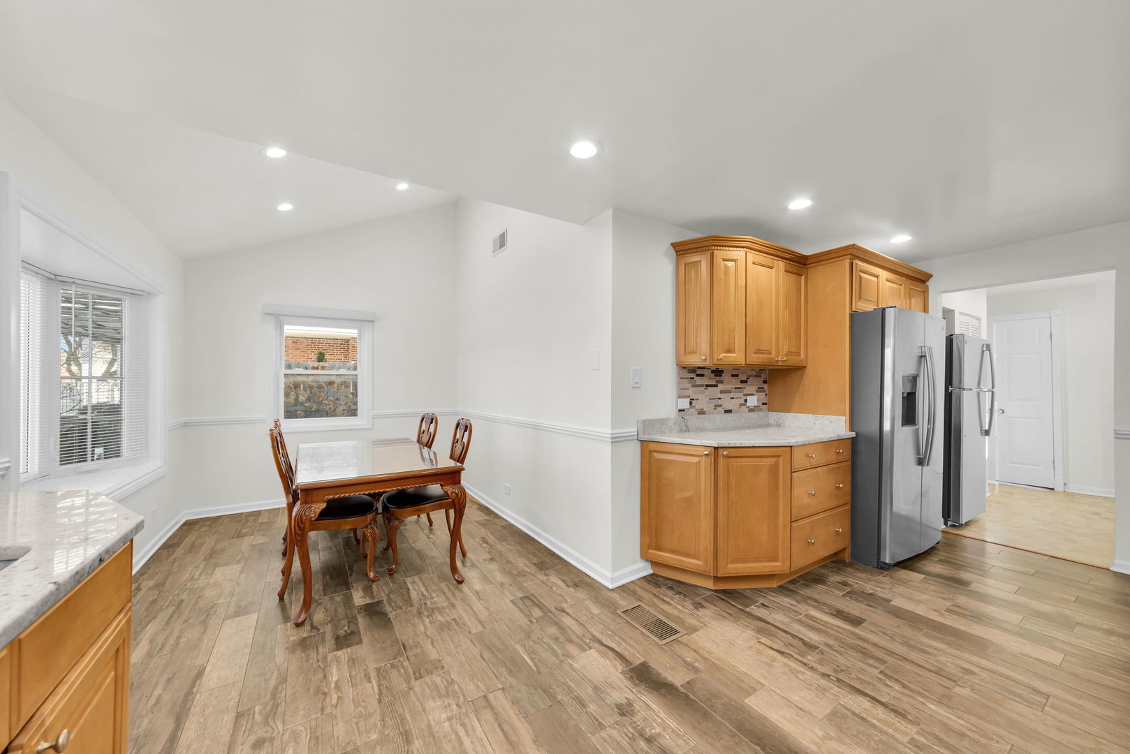 3505 Linneman Street Glenview, IL 60025 - Photo 10 of 36 a view of a kitchen with a sink and a refrigerator